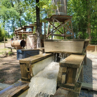 Mining sluice in operation with running water<br />